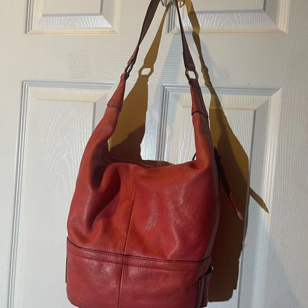 B Makowsky leather orange Hobo bucket style shoulder bag  silver tone hardwares